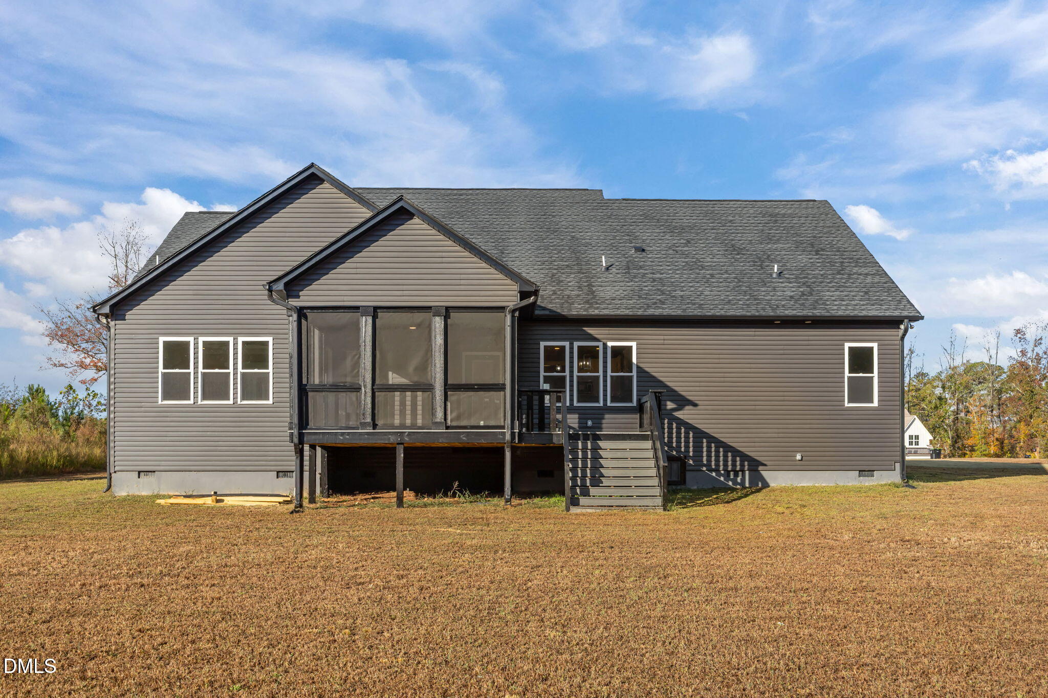 8629 Dukes Lake Road Zebulon, NC 27597 - Photo 39 of 52 a front view of a house with a yard and garage