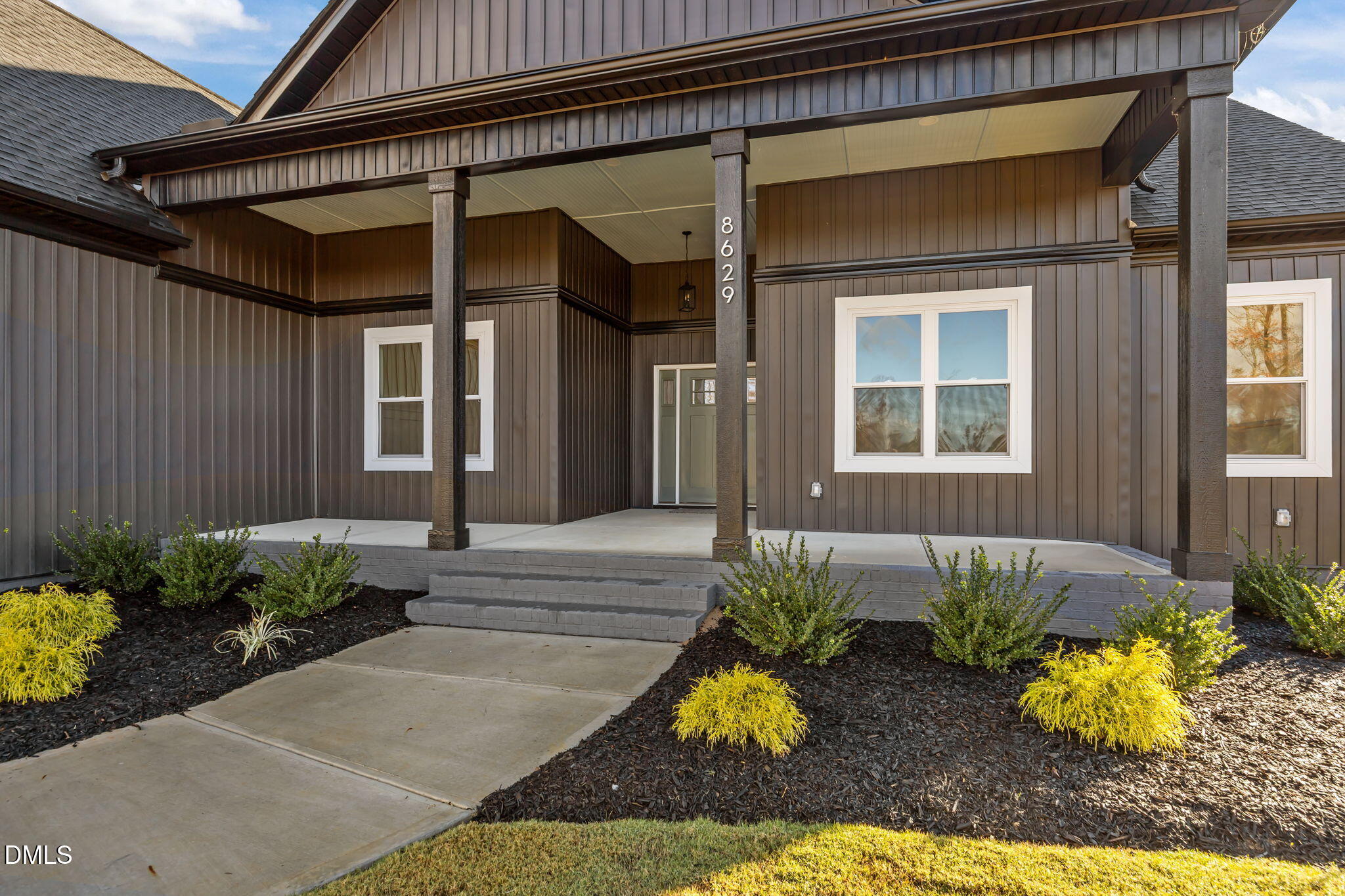 8629 Dukes Lake Road Zebulon, NC 27597 - Photo 4 of 52 a view of a house with a yard and sitting area