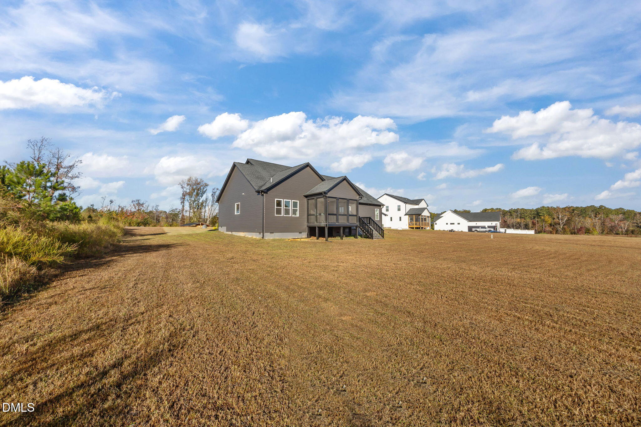 8629 Dukes Lake Road Zebulon, NC 27597 - Photo 42 of 52 a view of a house with a yard