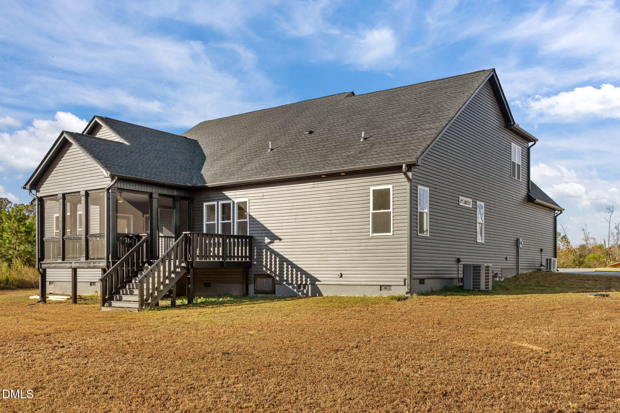 8629 Dukes Lake Road Zebulon, NC 27597 - Photo 43 of 52 a house view with a outdoor space