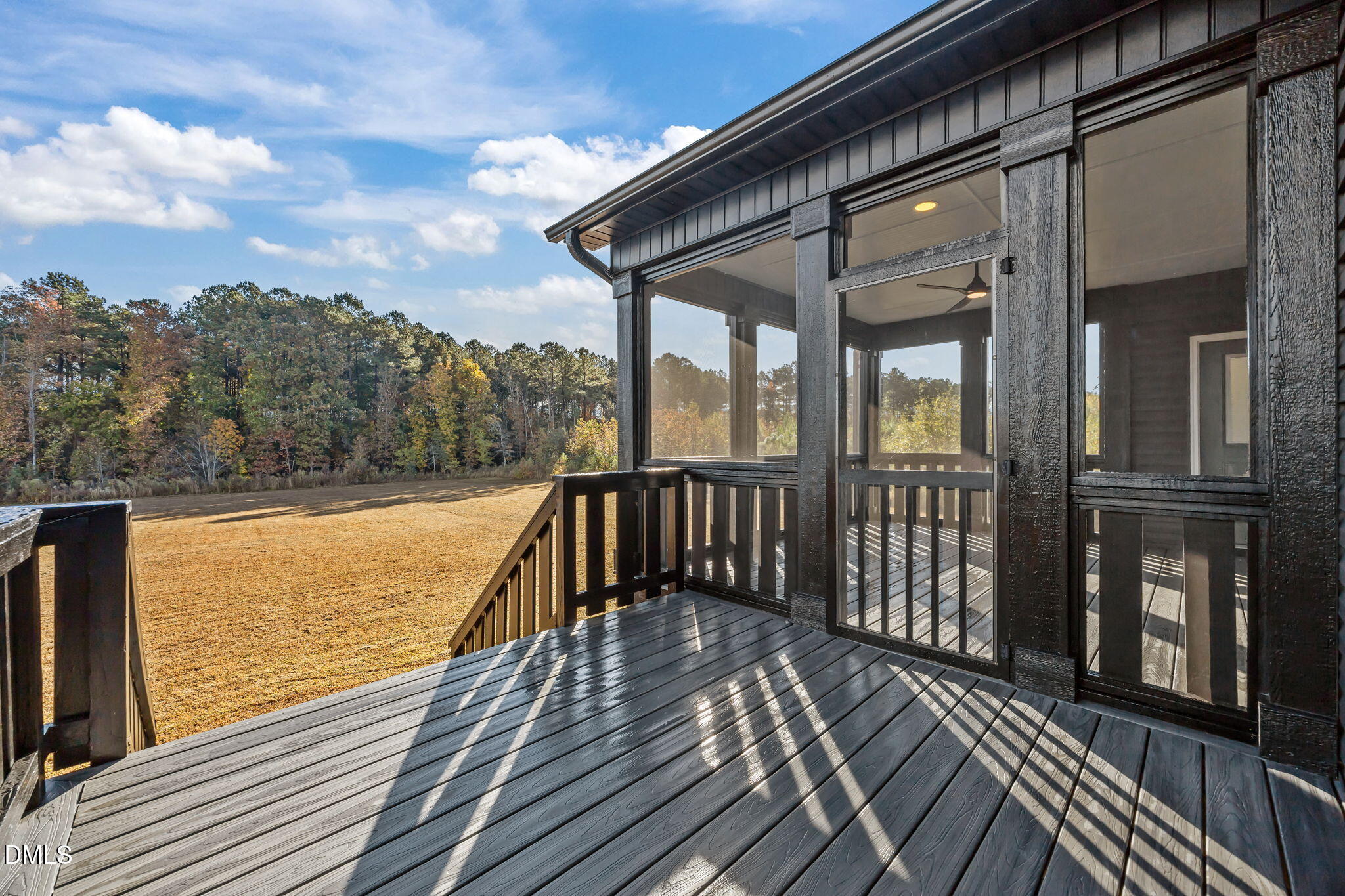 8629 Dukes Lake Road Zebulon, NC 27597 - Photo 45 of 52 a view of balcony with wooden floor and fence