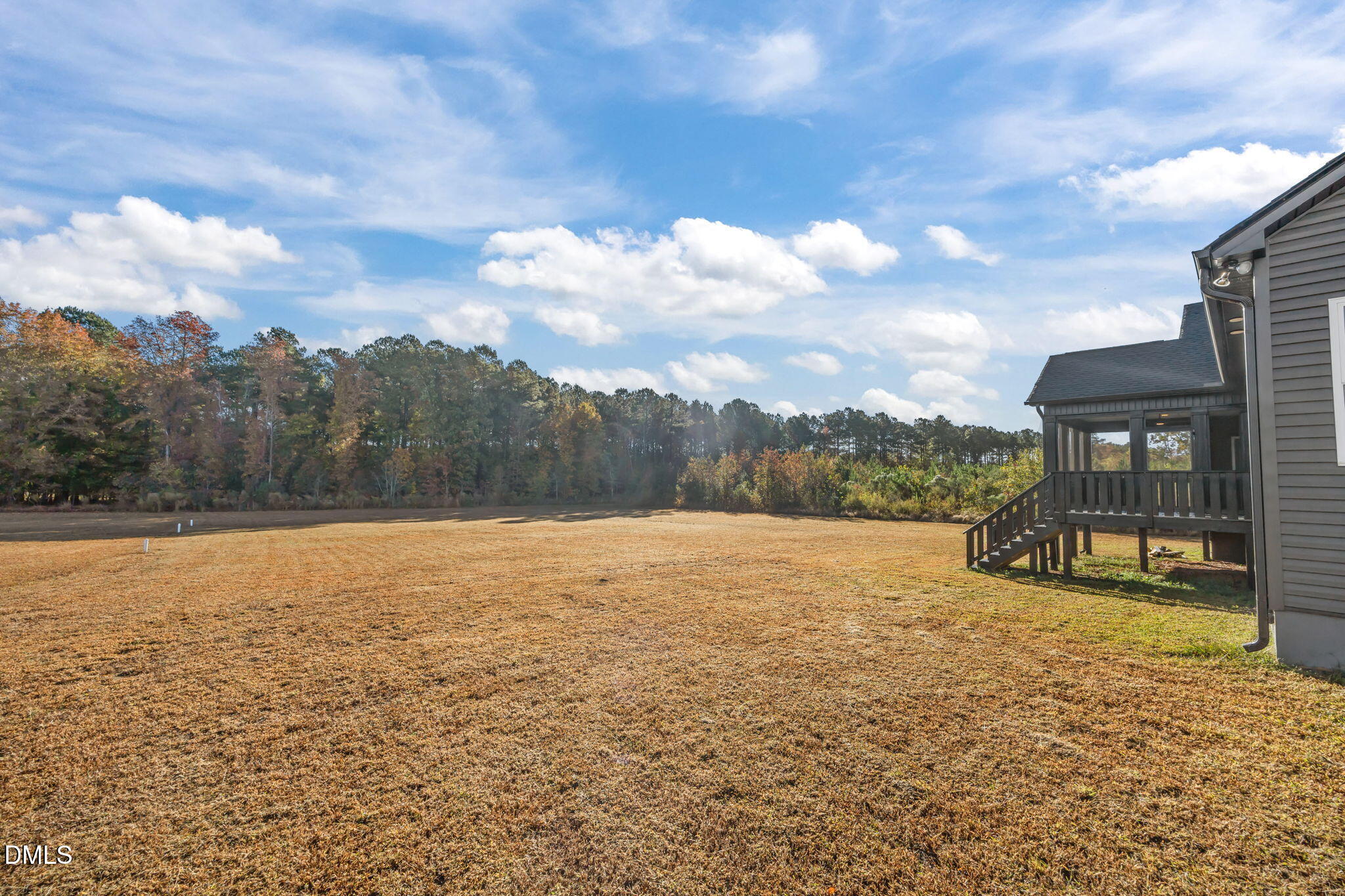 8629 Dukes Lake Road Zebulon, NC 27597 - Photo 46 of 52 a view of a lake with a big yard