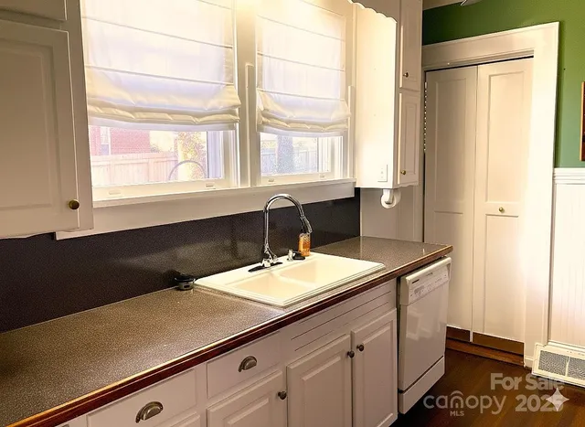 a bathroom with a sink and a window