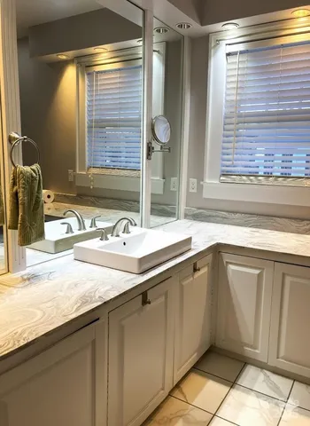 a bathroom with a sink and a mirror