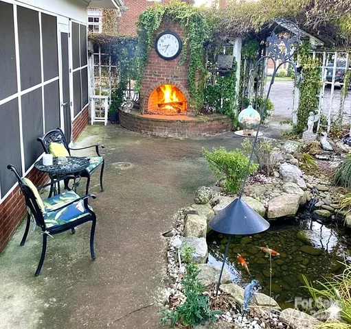 a view of a chairs and fire pit in the patio
