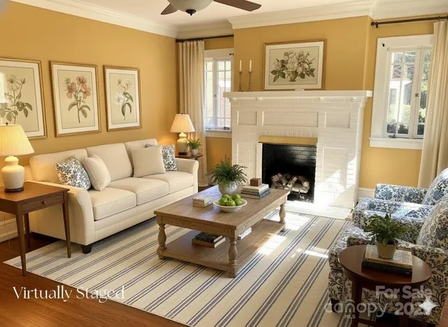 a living room with furniture and a fireplace