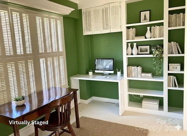 a workspace with furniture and a window