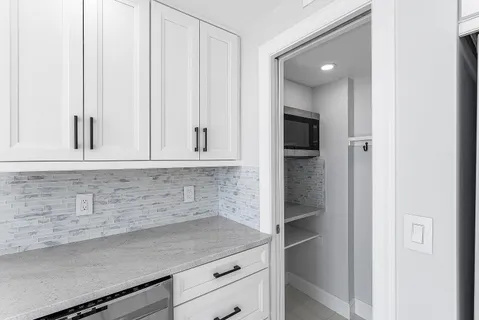 a view of cabinets and window