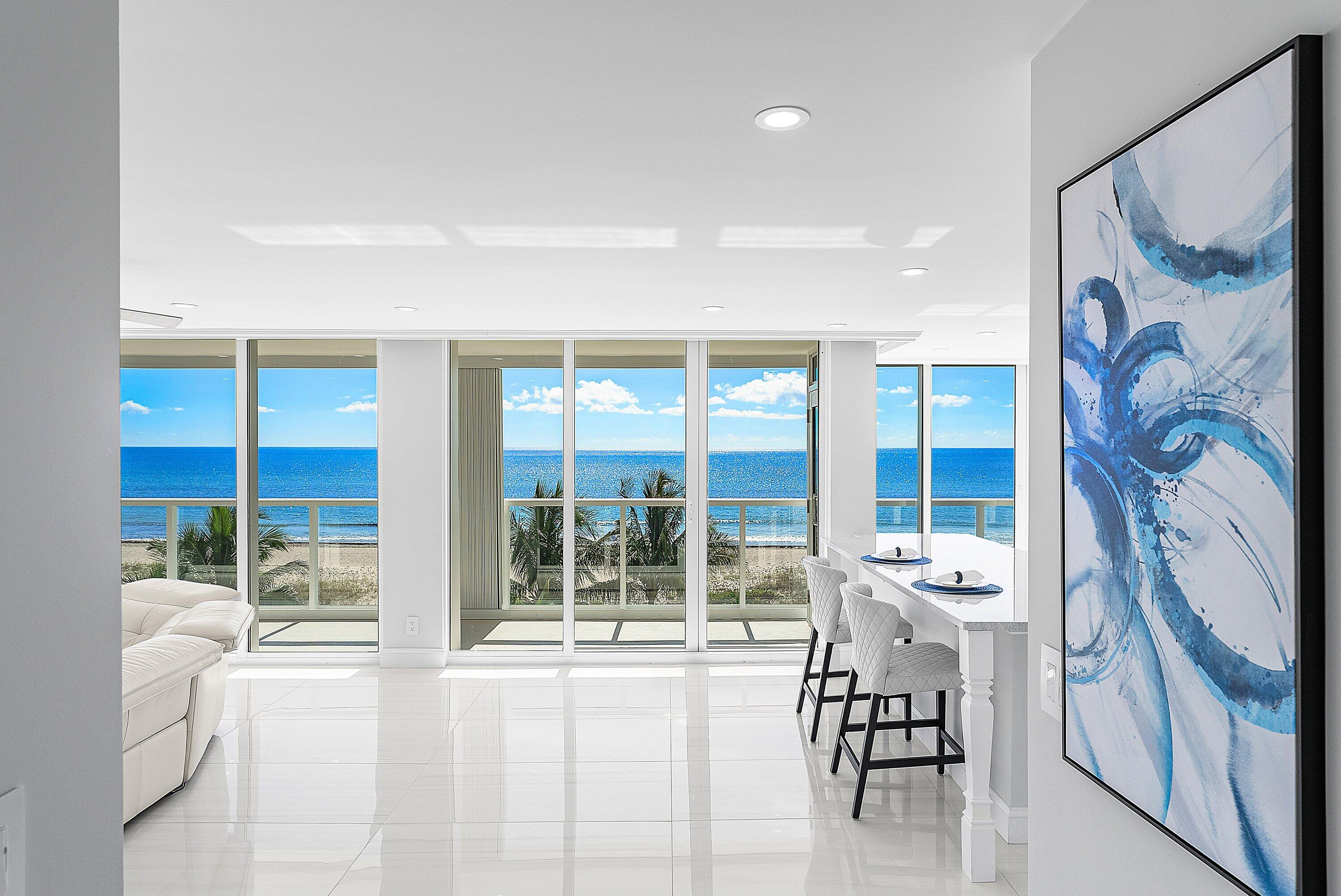 2800 South Ocean Boulevard, Unit 4E Boca Raton, FL 33432 - Photo 18 of 51 a living room with furniture and a large window with outer view
