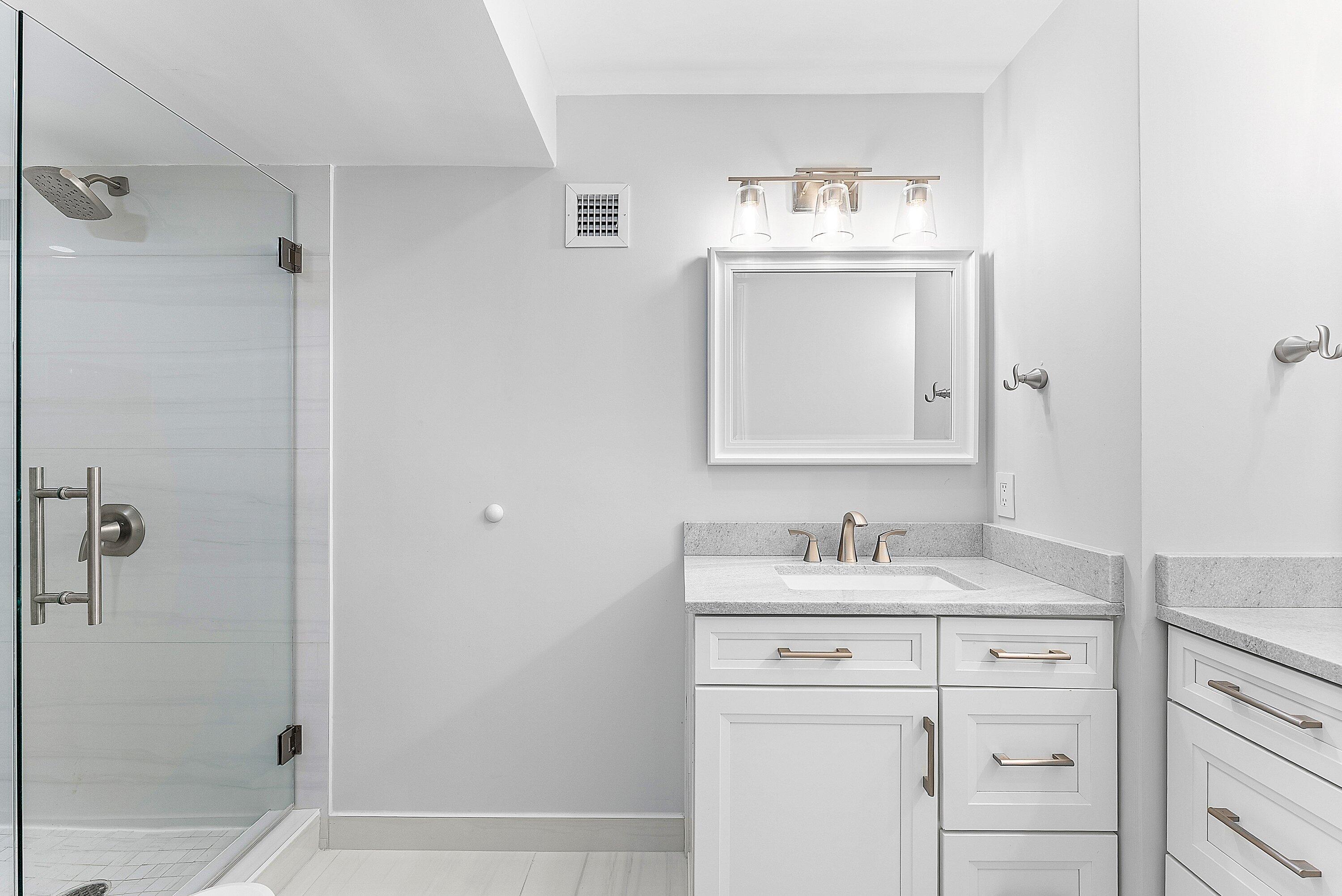2800 South Ocean Boulevard, Unit 4E Boca Raton, FL 33432 - Photo 24 of 51 a bathroom with a sink and a mirror