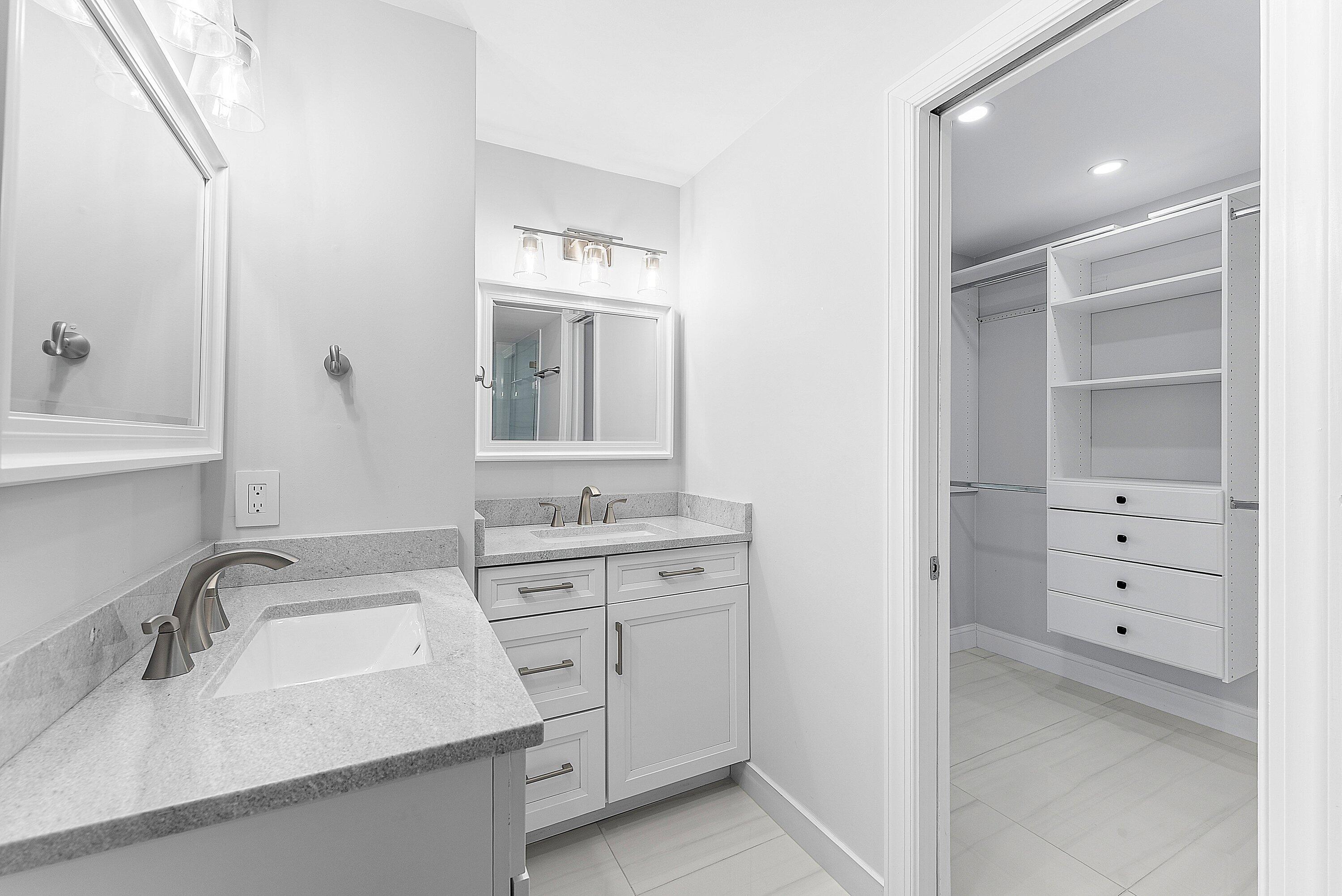 2800 South Ocean Boulevard, Unit 4E Boca Raton, FL 33432 - Photo 26 of 51 a bathroom with a sink and a mirror