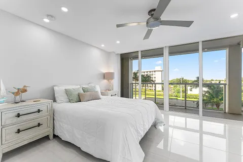 a bedroom with a bed and a lamp