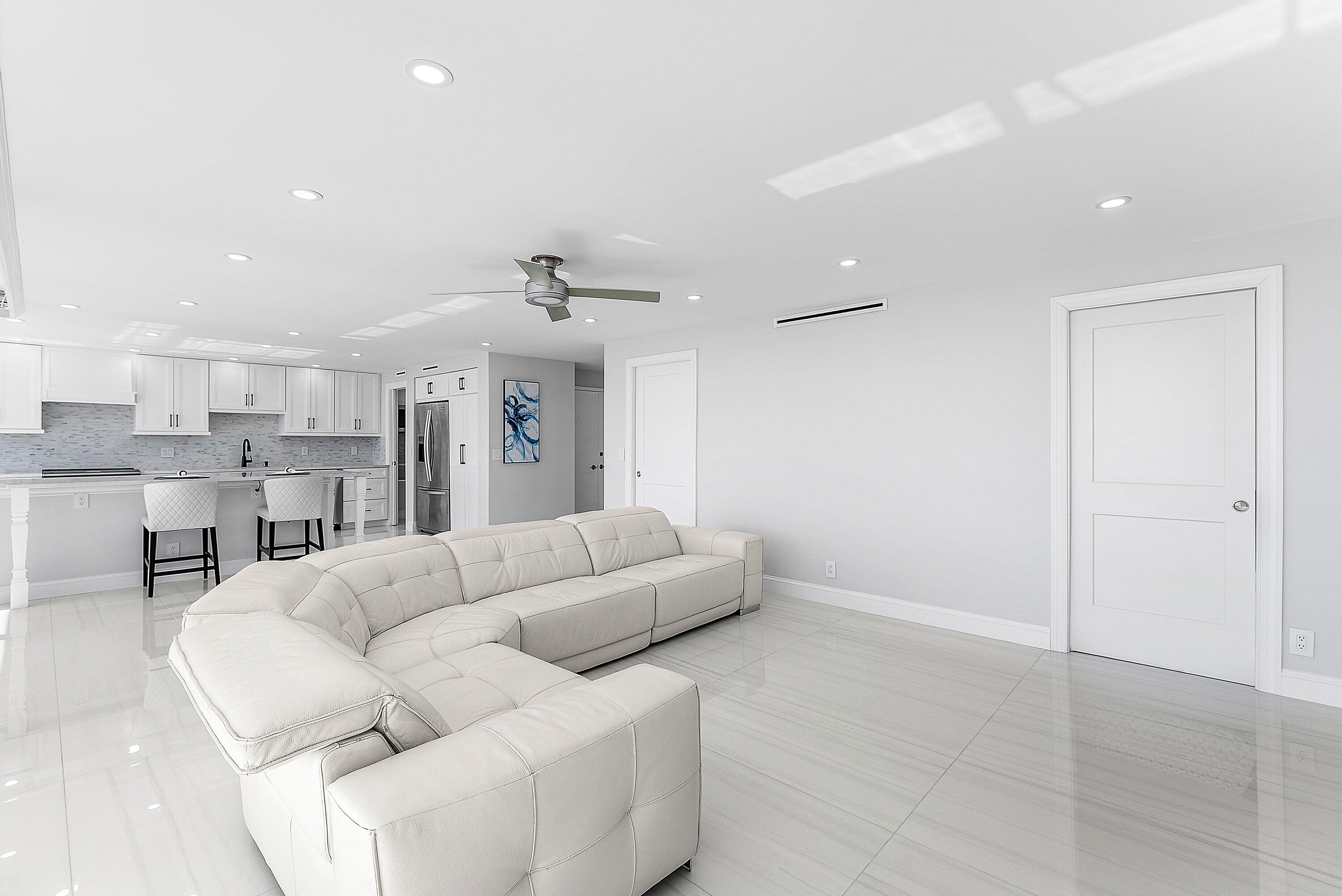 2800 South Ocean Boulevard, Unit 4E Boca Raton, FL 33432 - Photo 37 of 51 a living room with furniture and a chandelier