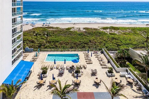 a view of a swimming pool with a lounge chairs