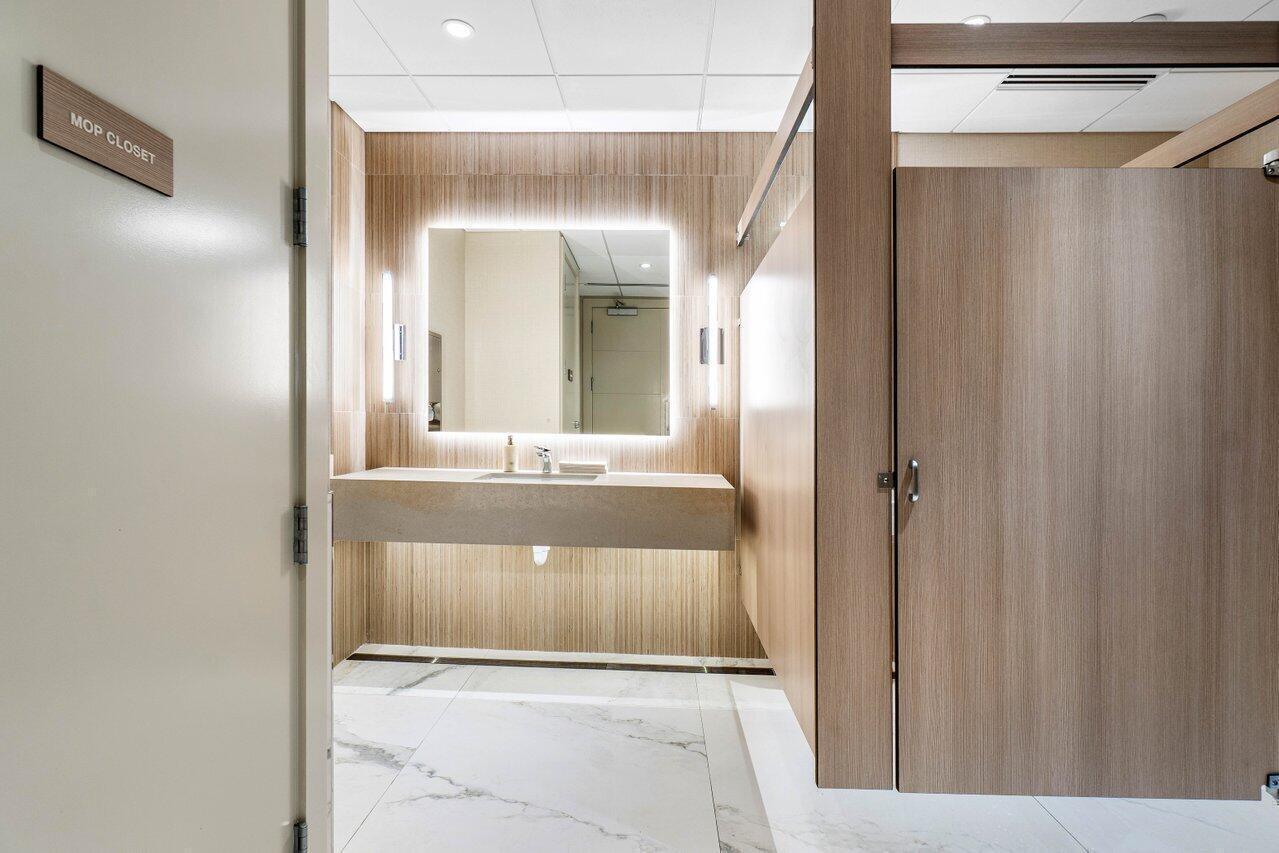 2800 South Ocean Boulevard, Unit 4E Boca Raton, FL 33432 - Photo 48 of 51 a bathroom with a sink and a mirror