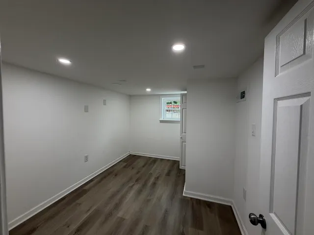 a view of room with wooden floor