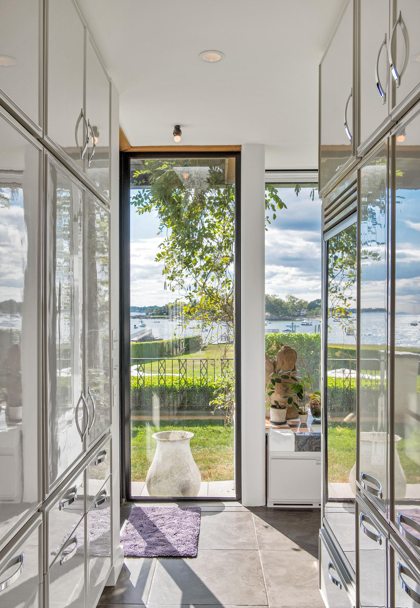 163 Pear Tree Point Road Darien, CT 06820 - Photo 17 of 24 a room with window and a bed