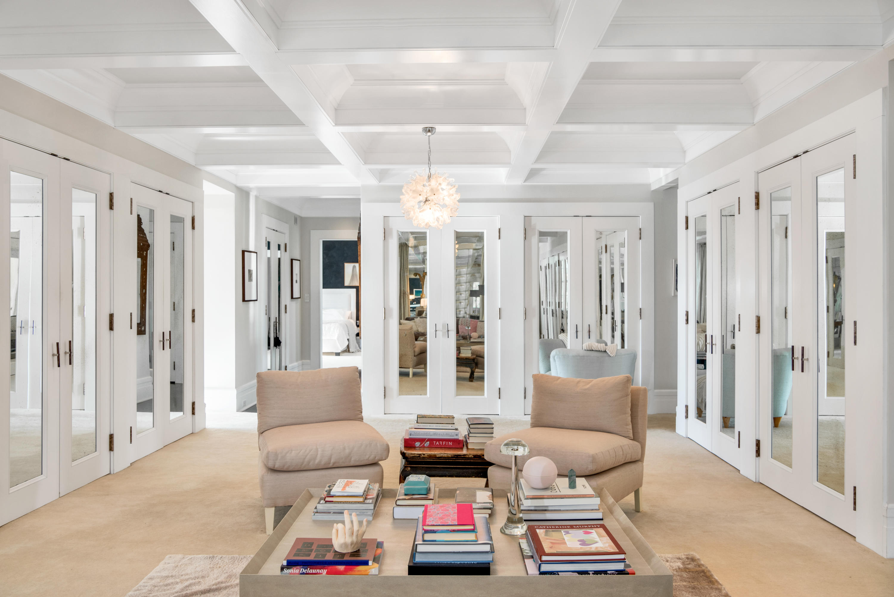 163 Pear Tree Point Road Darien, CT 06820 - Photo 21 of 24 a living room with furniture and a chandelier