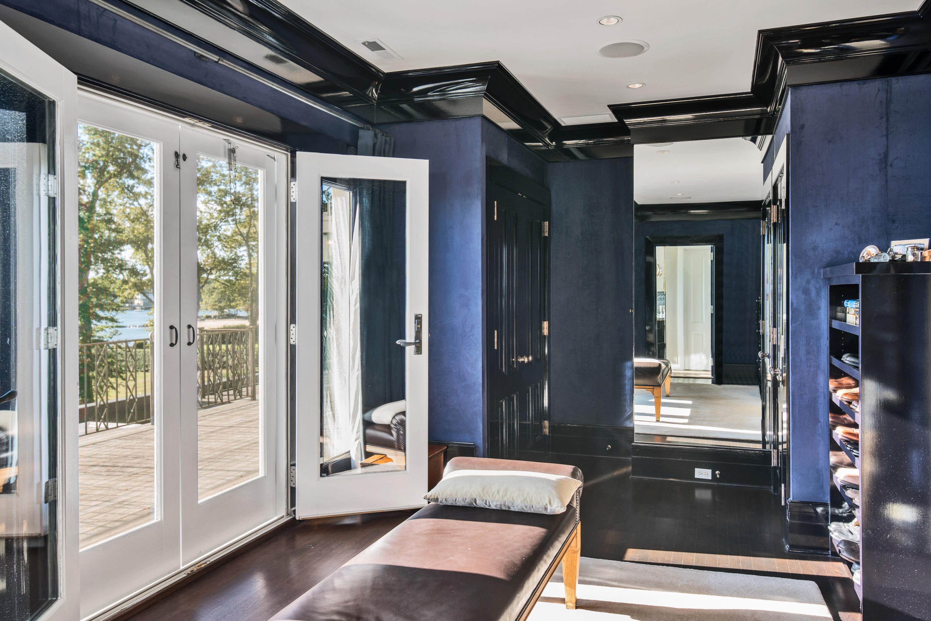163 Pear Tree Point Road Darien, CT 06820 - Photo 23 of 24 a living room with furniture and large windows