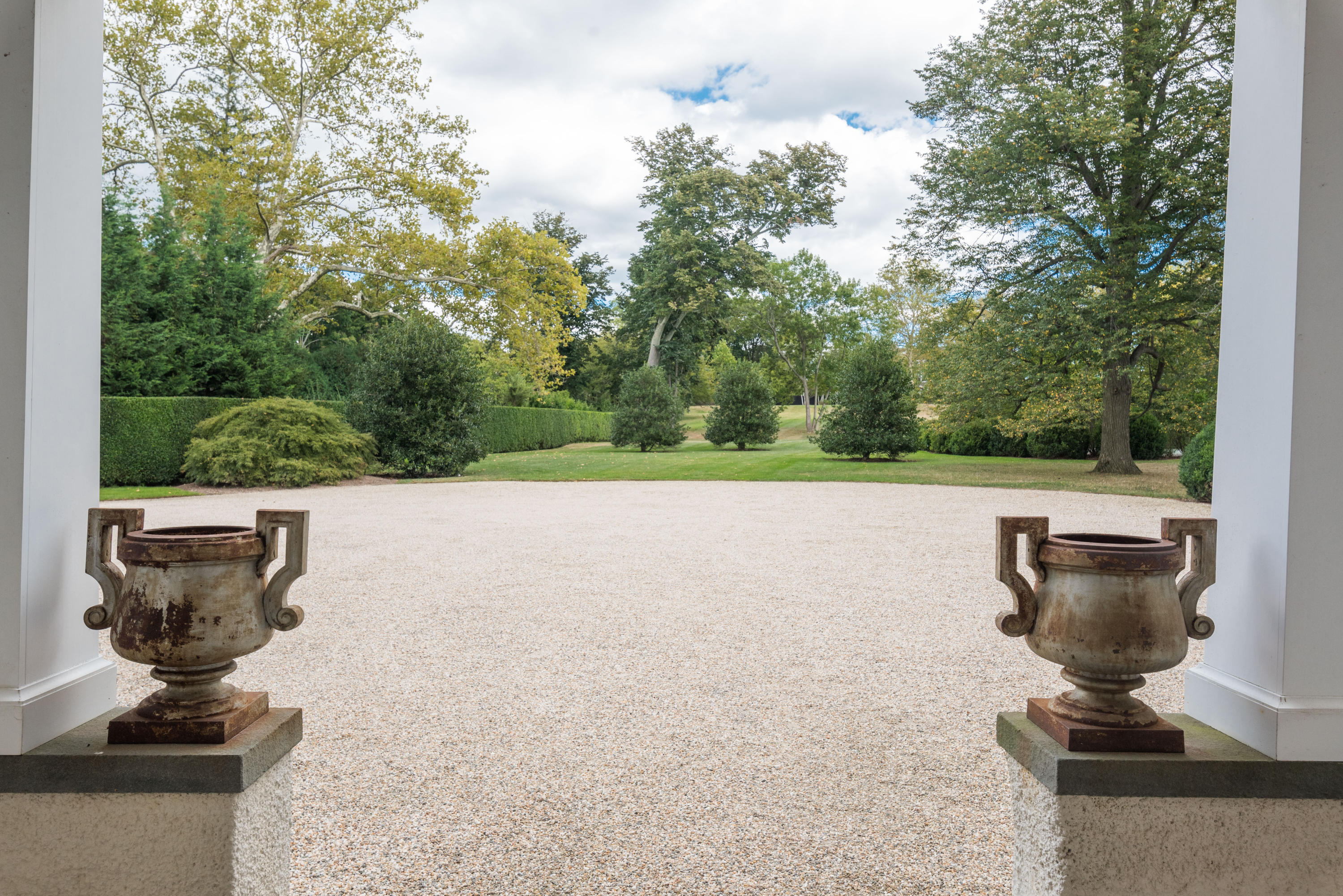 163 Pear Tree Point Road Darien, CT 06820 - Photo 6 of 24 a view of a fountain in the yard next to a fountain