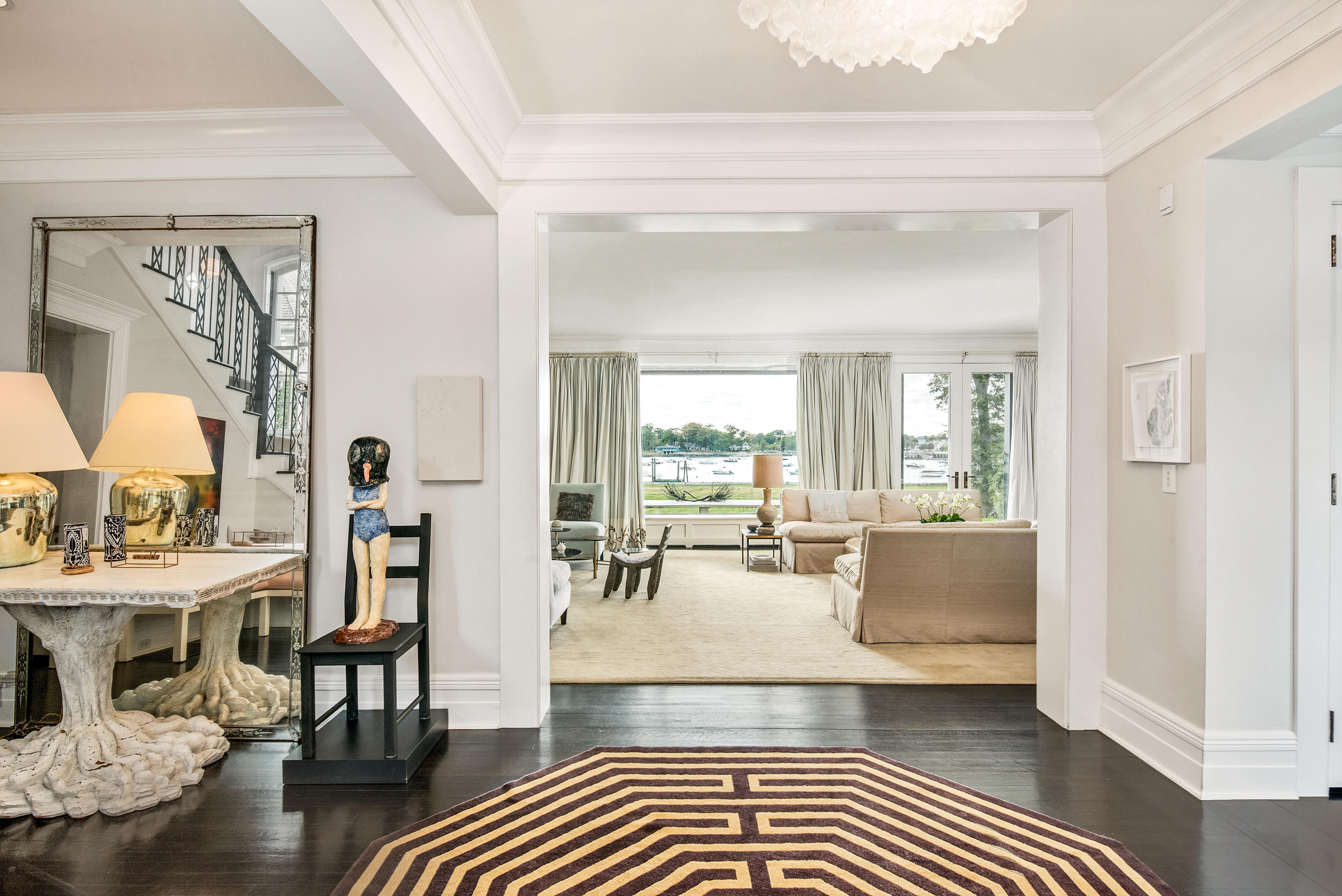 163 Pear Tree Point Road Darien, CT 06820 - Photo 7 of 24 a living room with furniture and wooden floor