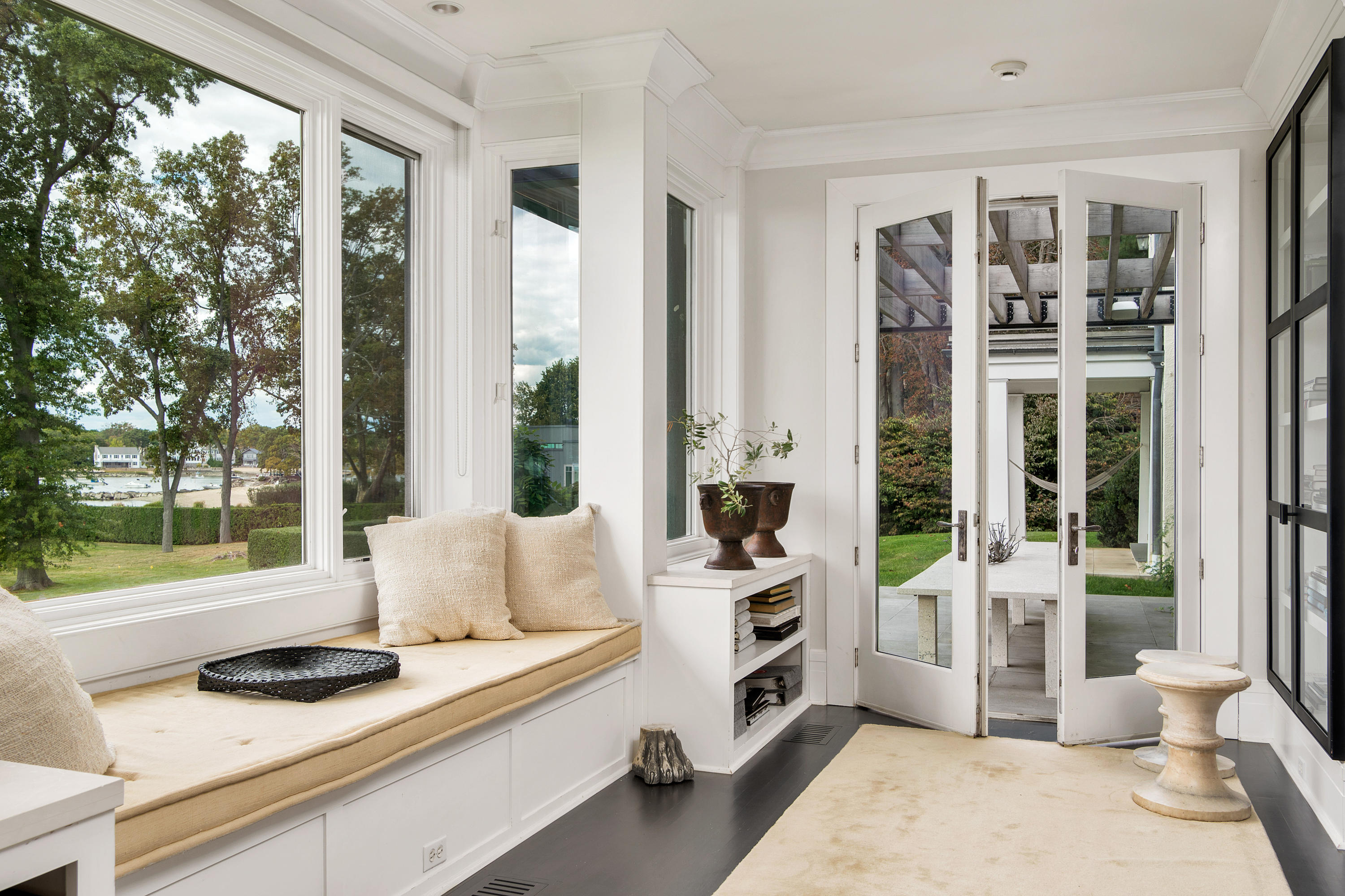 163 Pear Tree Point Road Darien, CT 06820 - Photo 8 of 24 a room with furniture and a window