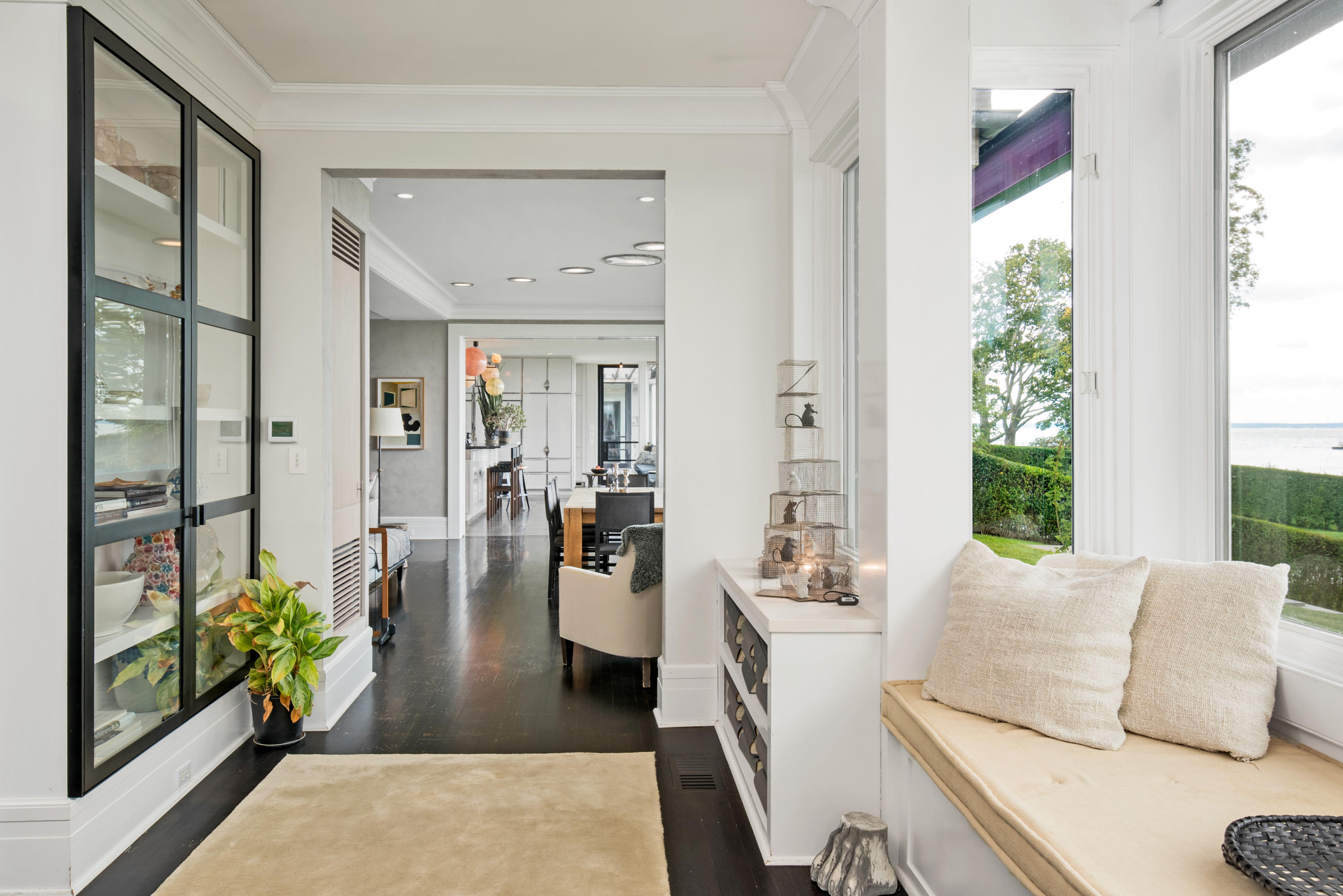 163 Pear Tree Point Road Darien, CT 06820 - Photo 9 of 24 a living room with furniture and a large window