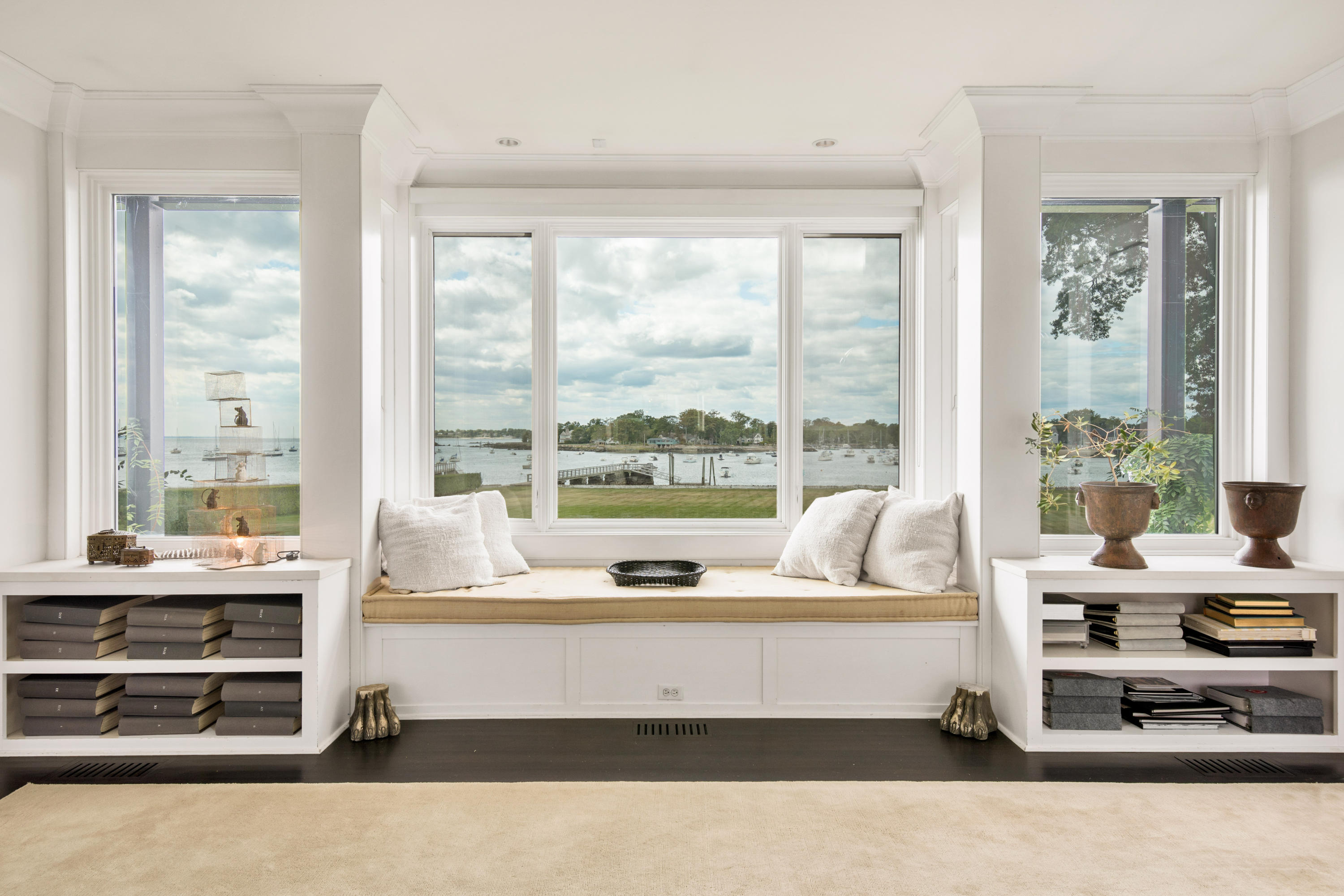 163 Pear Tree Point Road Darien, CT 06820 - Photo 10 of 24 a living room with furniture and large windows