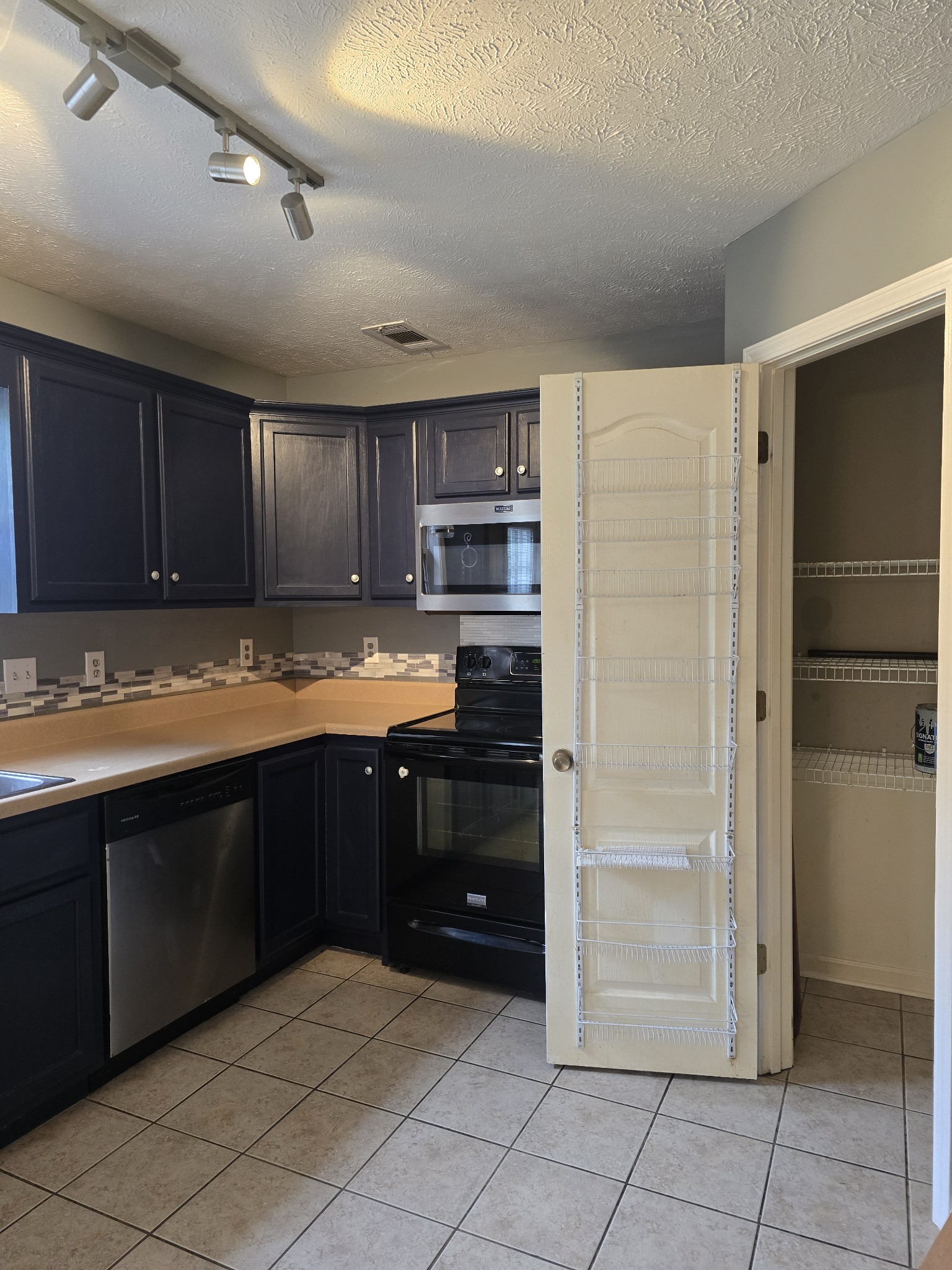 270 Reed Circle Medina, TN 38355 - Photo 12 of 31 a kitchen with granite countertop a refrigerator and a sink