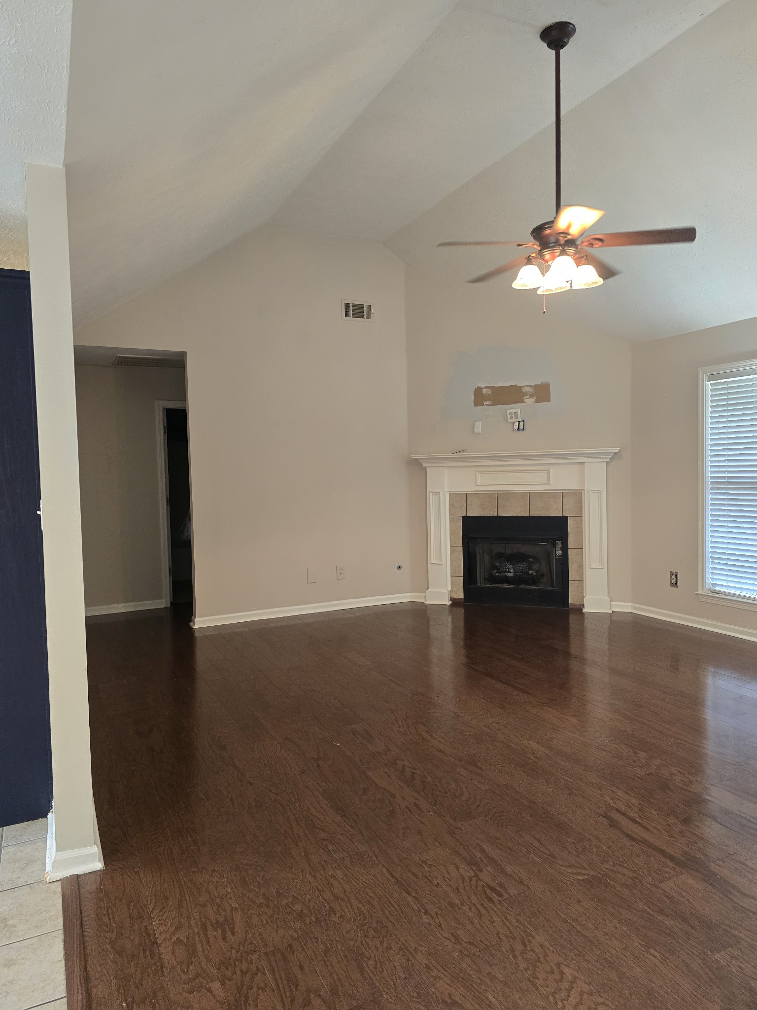 270 Reed Circle Medina, TN 38355 - Photo 6 of 31 a view of a livingroom with a fireplace a chandelier fan and a fireplace