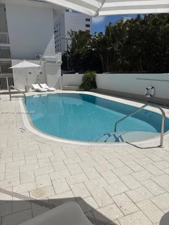 a view of a livingroom with furniture and windows