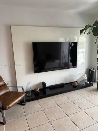 a kitchen with granite countertop a sink stove and cabinets