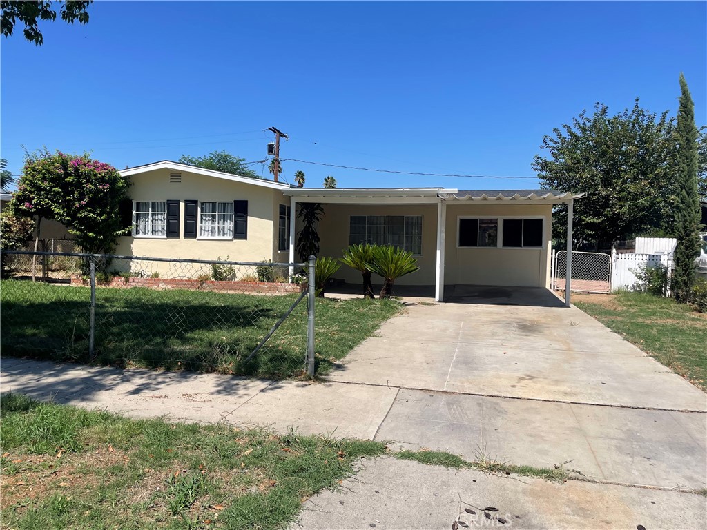 7465 Santa Rosa Way Riverside, CA 92504 - Photo 1 of 1 a front view of a house with garden