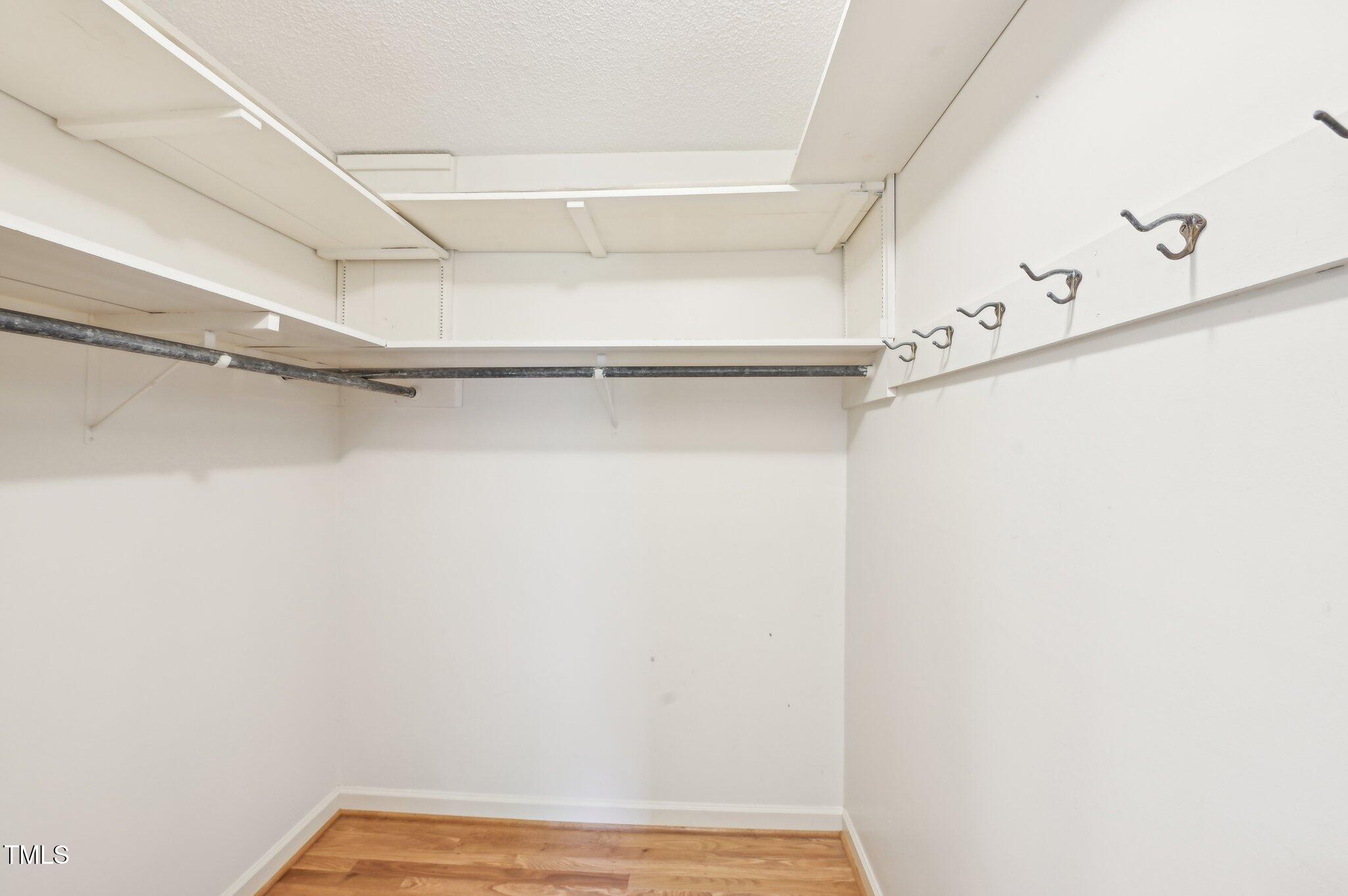 3011 Old Hillsborough Road Mebane, NC 27302 - Photo 19 of 29 a view of walk in closet with empty racks