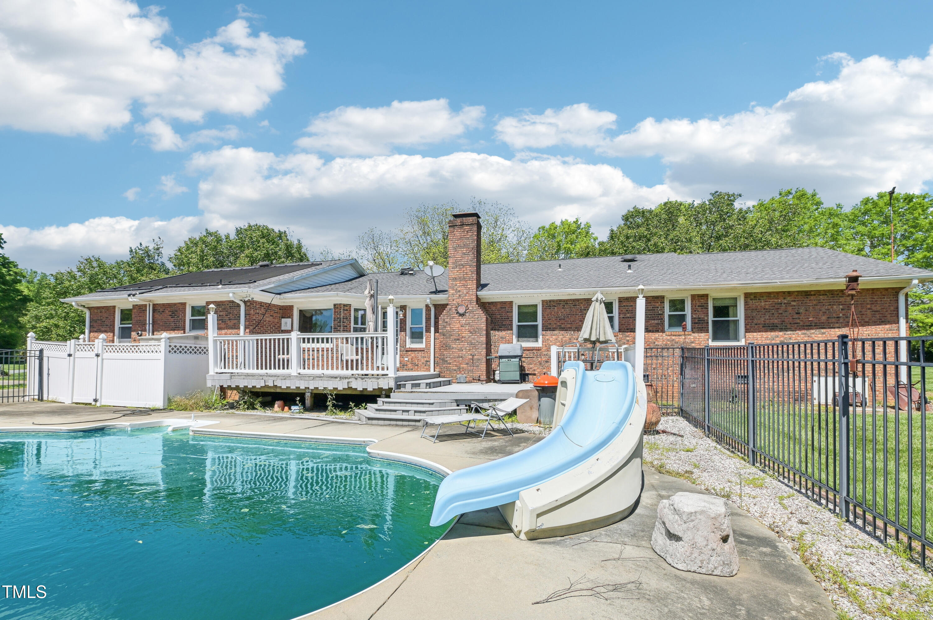 3011 Old Hillsborough Road Mebane, NC 27302 - Photo 26 of 29 a front view of a house with a yard table and chairs