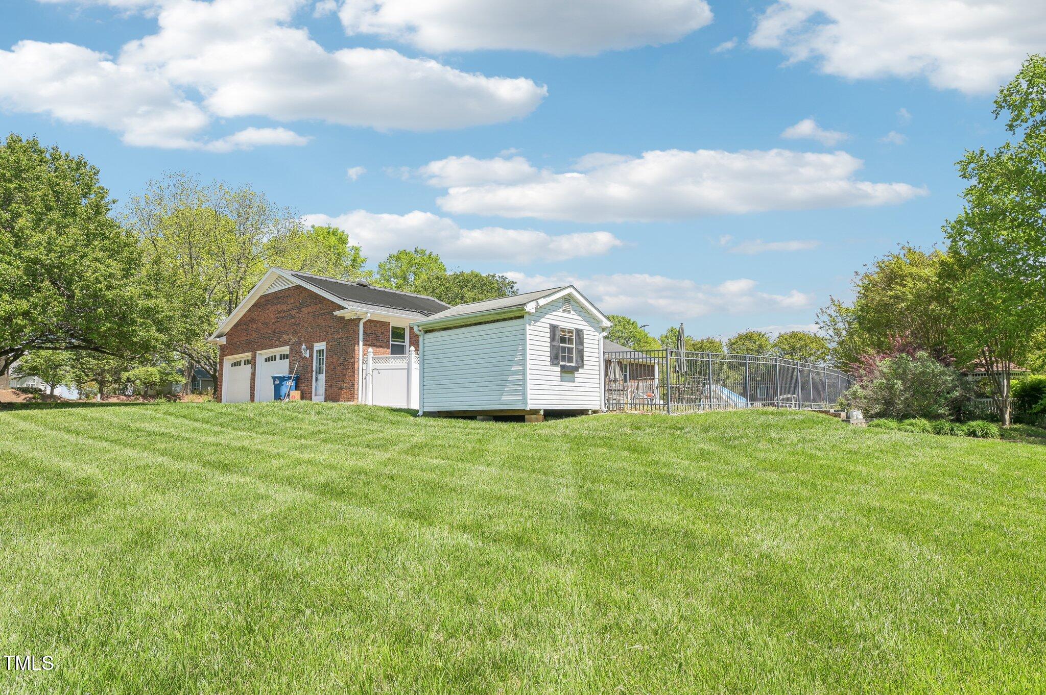 3011 Old Hillsborough Road Mebane, NC 27302 - Photo 27 of 29 a front view of a house with a yard