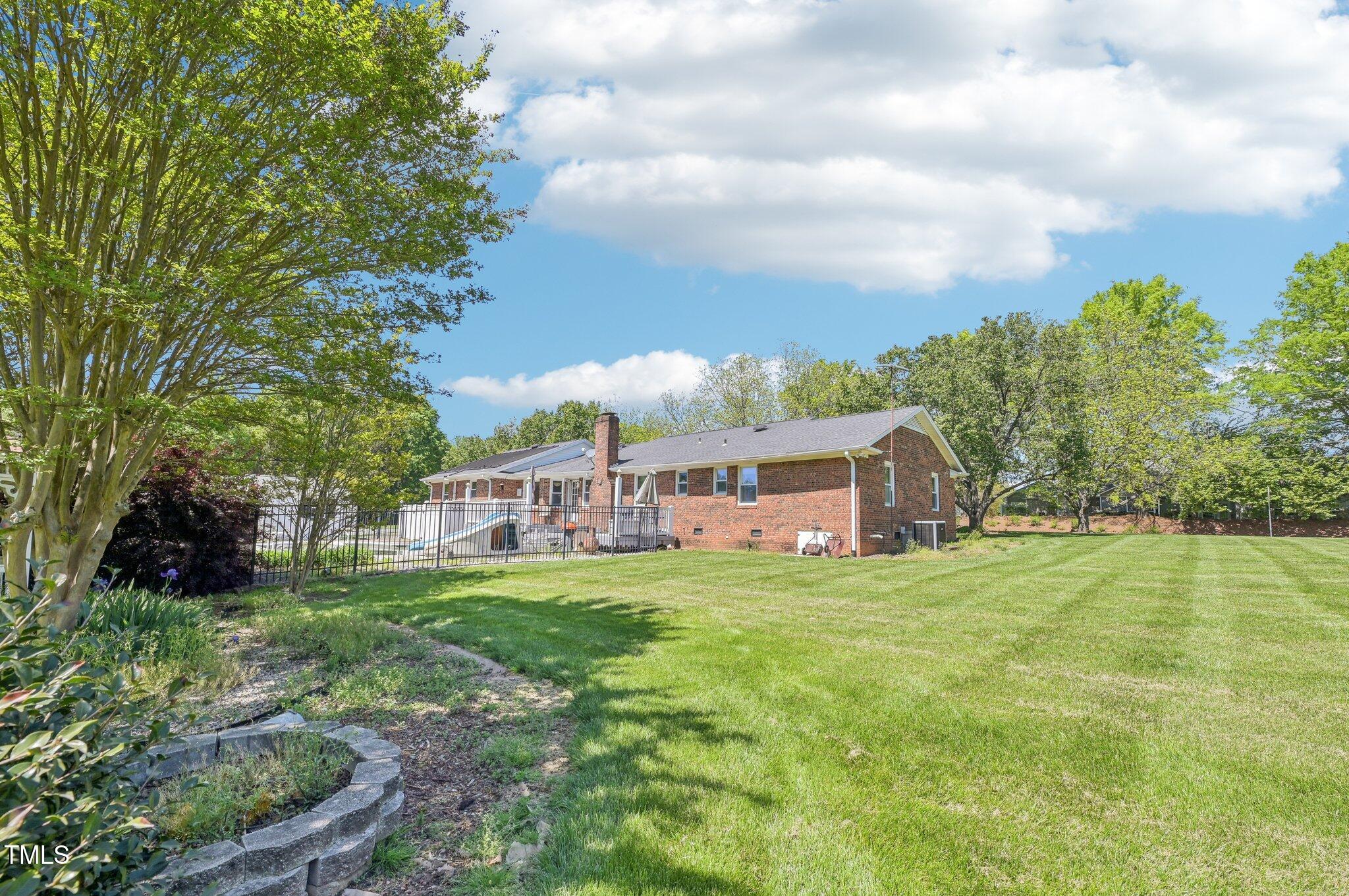 3011 Old Hillsborough Road Mebane, NC 27302 - Photo 29 of 29 a view of a house with a big yard and a large trees