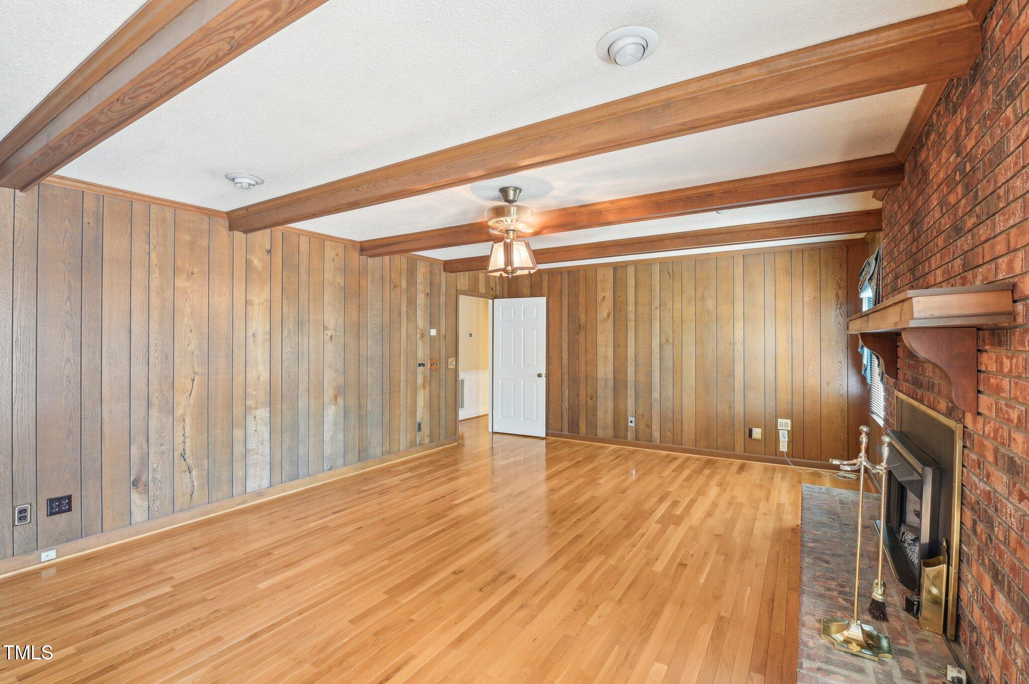 3011 Old Hillsborough Road Mebane, NC 27302 - Photo 5 of 29 a view of empty room with wooden floor and fan