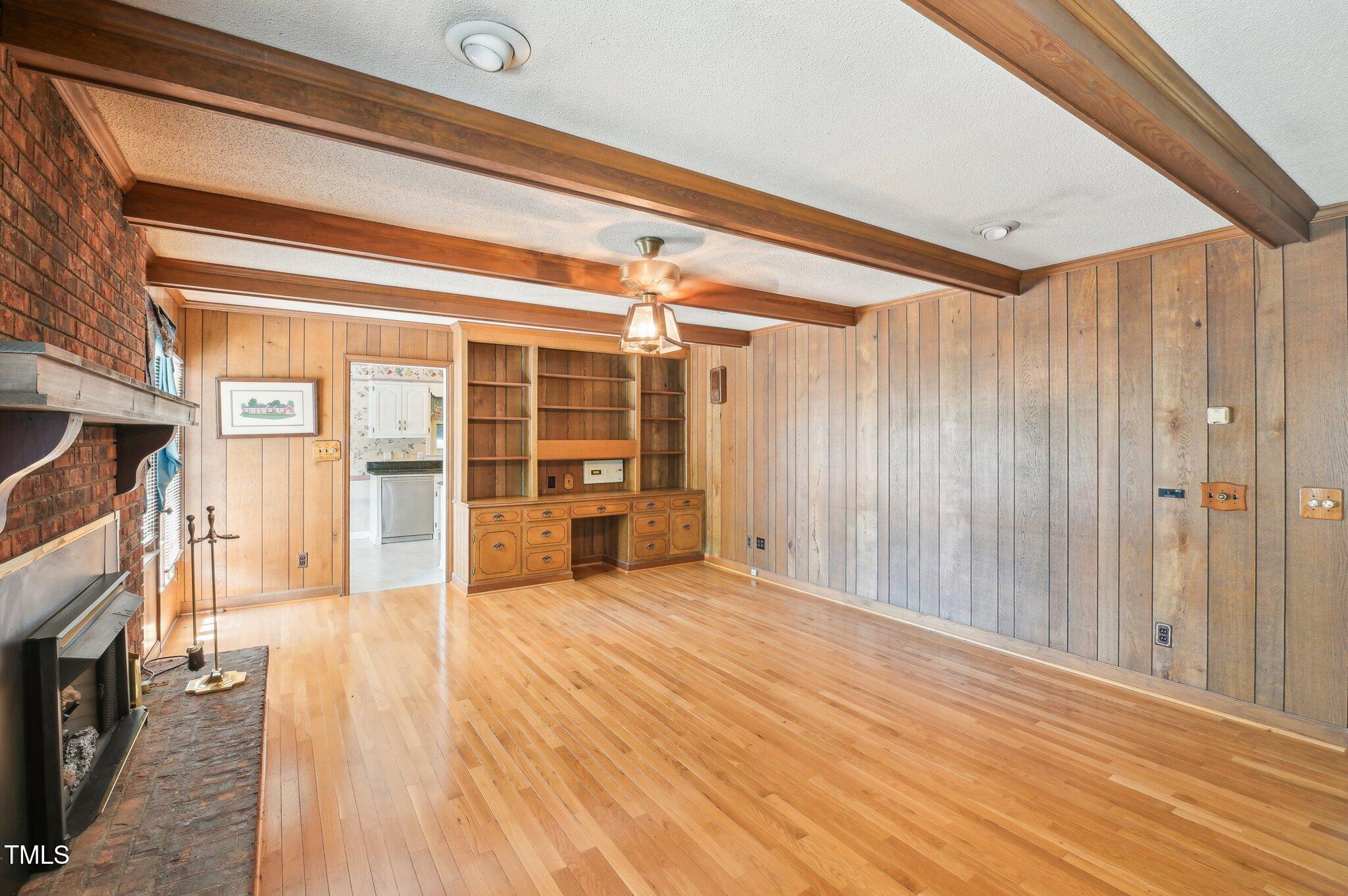 3011 Old Hillsborough Road Mebane, NC 27302 - Photo 6 of 29 a view of an empty room with wooden floor and a window