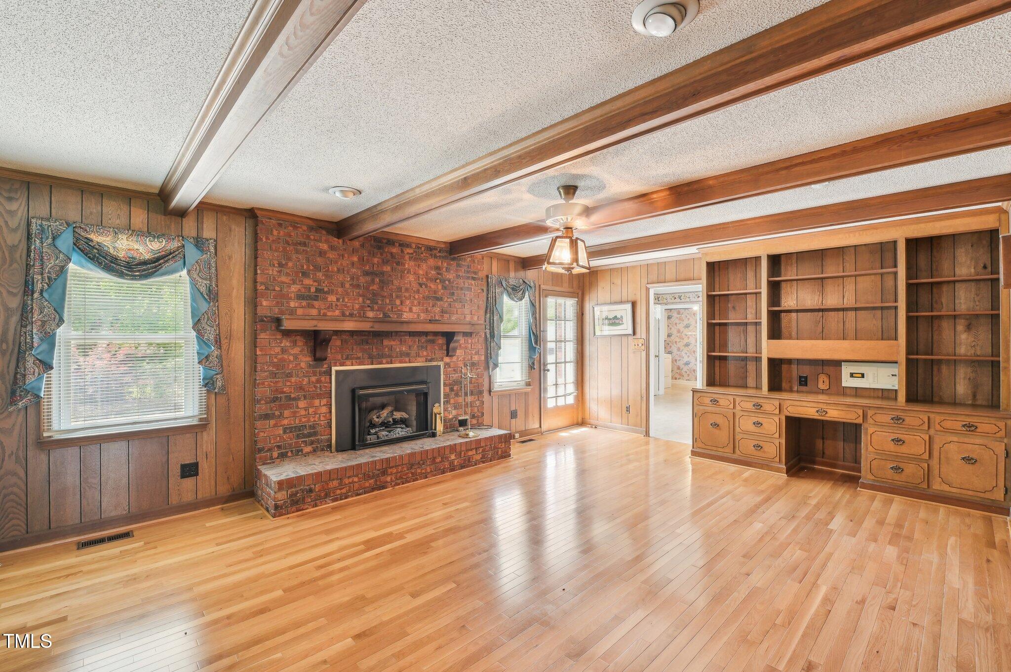 3011 Old Hillsborough Road Mebane, NC 27302 - Photo 7 of 29 a view of a livingroom with a fireplace window and wooden floor