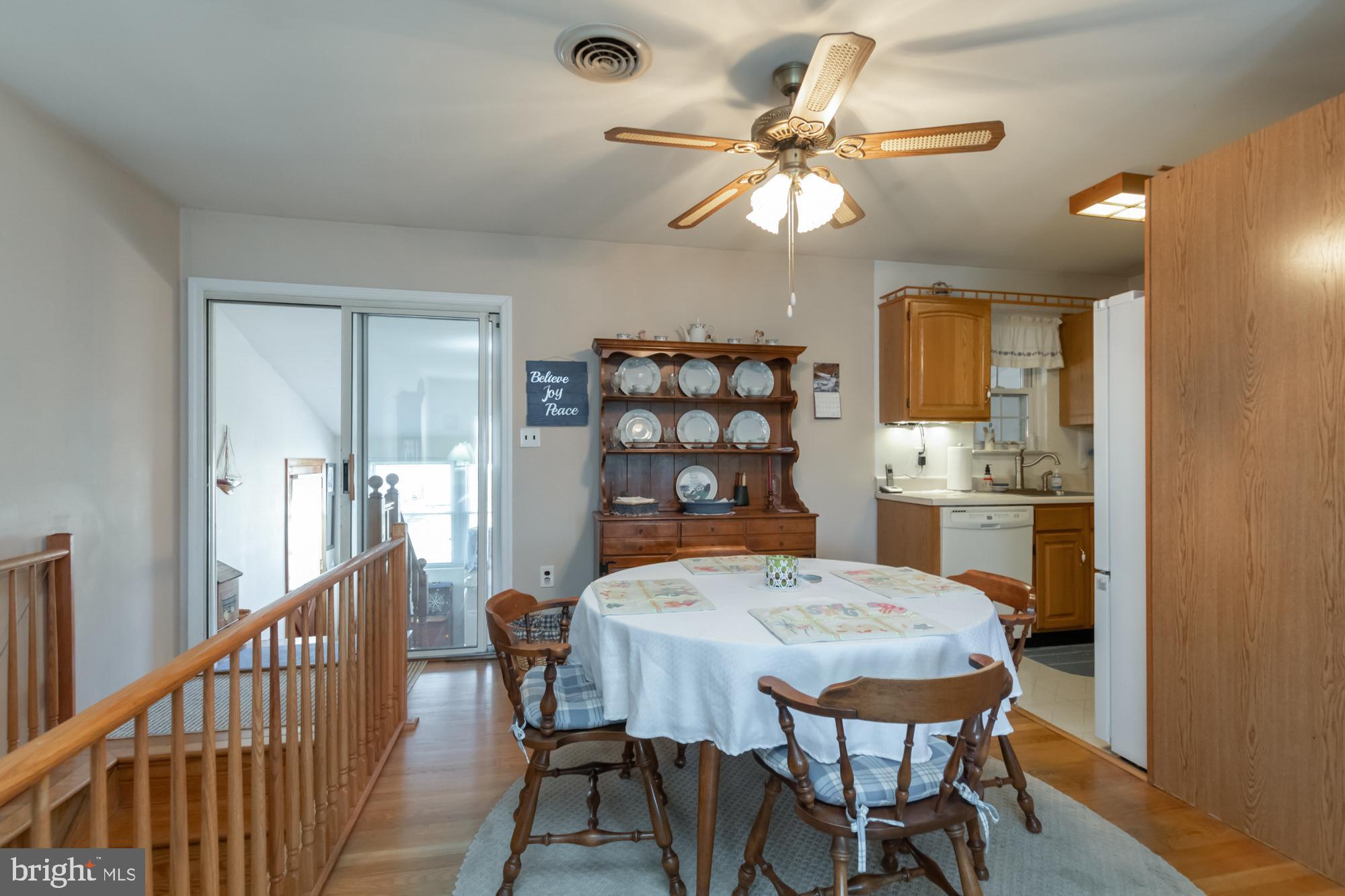 1492 Thies Drive Pasadena, MD 21122 - Photo 8 of 37 Sliders from dining room to sunroom