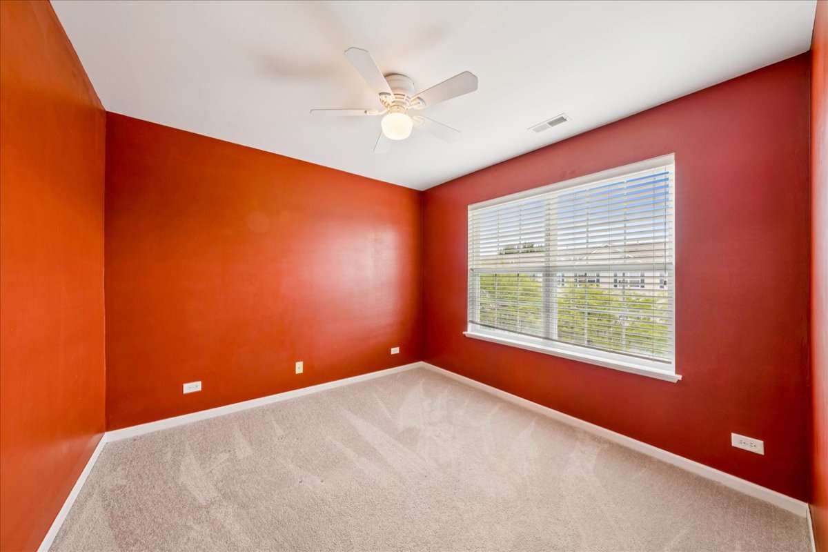 233 Jackson Street Gilberts, IL 60136 - Photo 15 of 29 an empty room with windows and fan