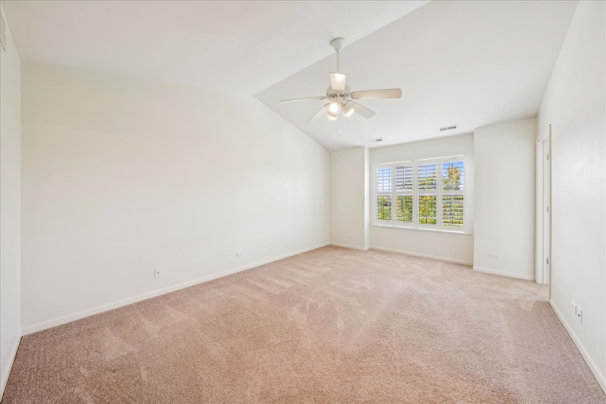 233 Jackson Street Gilberts, IL 60136 - Photo 18 of 29 an empty room with windows and fan