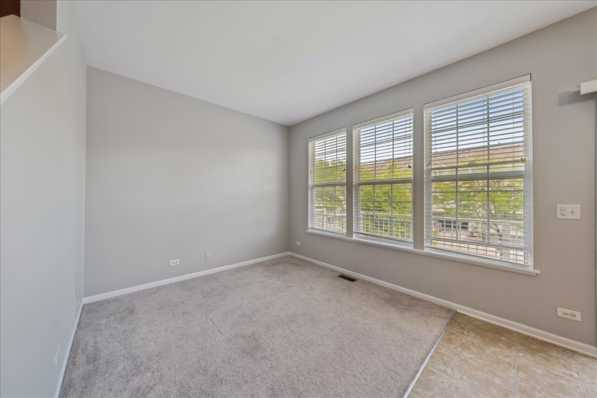 233 Jackson Street Gilberts, IL 60136 - Photo 7 of 29 a view of an empty room with a window