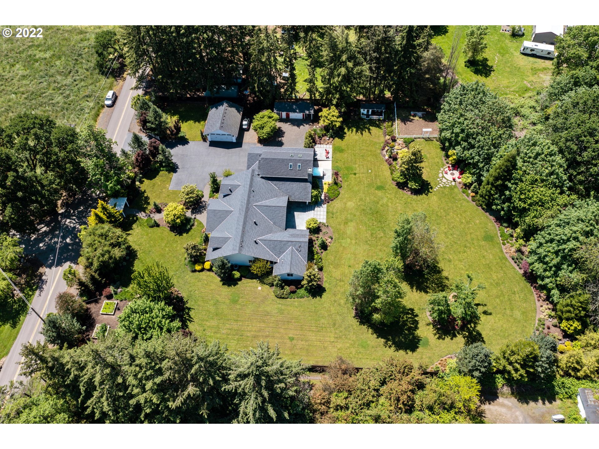 29195 Northeast Benjamin Road Newberg, OR 97132 - Photo 31 of 32 an aerial view of residential house with yard and swimming pool