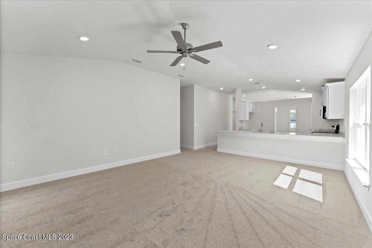 1341 Tupelo Circle Cocoa, FL 32926 - Photo 13 of 27 a view of a kitchen with a sink and cabinet with wooden floor
