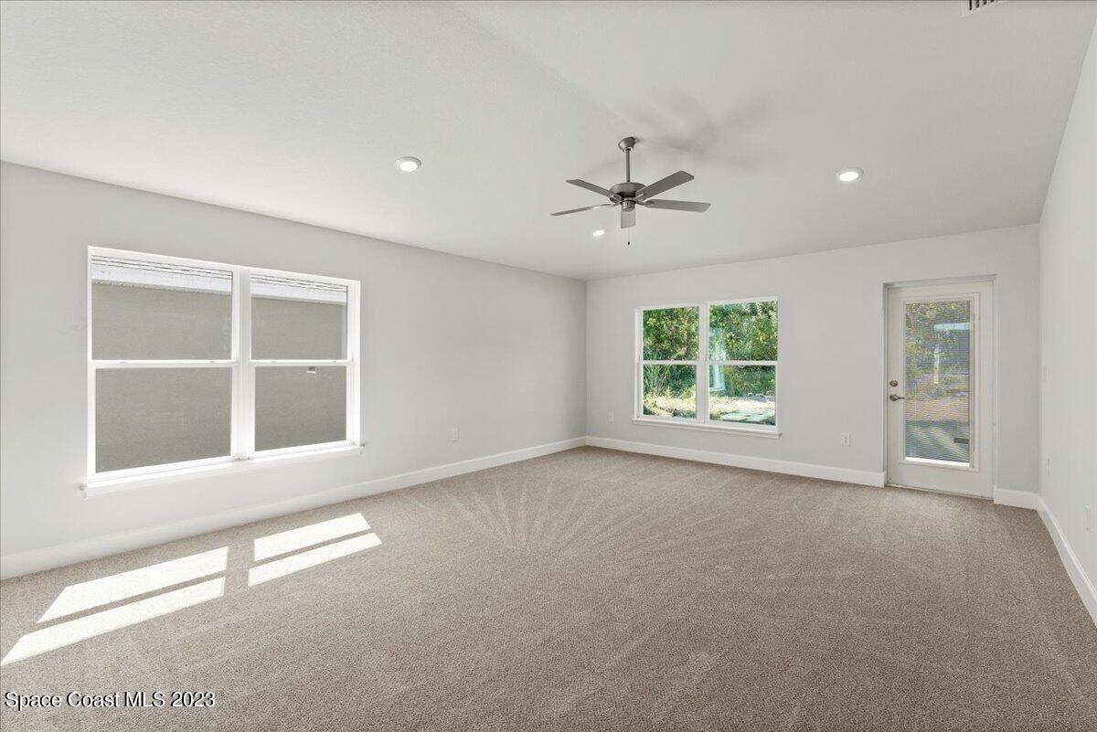 1341 Tupelo Circle Cocoa, FL 32926 - Photo 14 of 27 a view of an empty room with a window