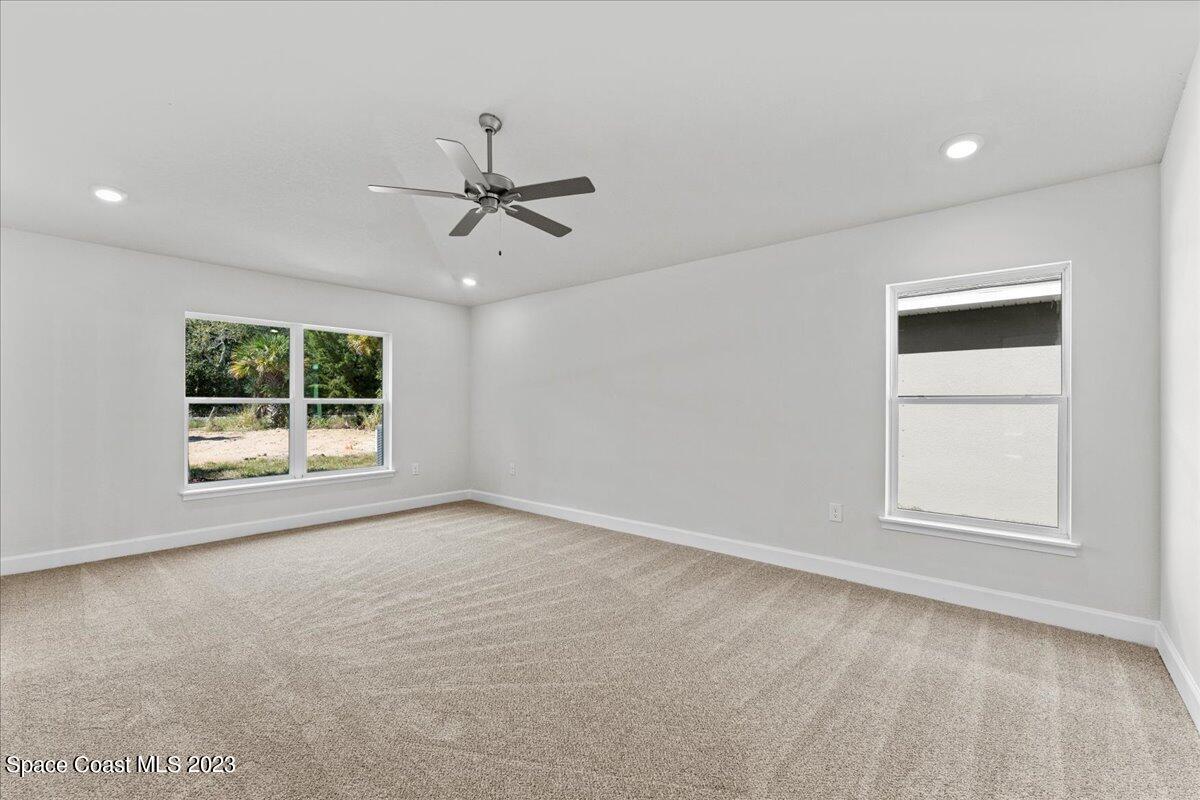 1341 Tupelo Circle Cocoa, FL 32926 - Photo 15 of 27 an empty room with windows and closet