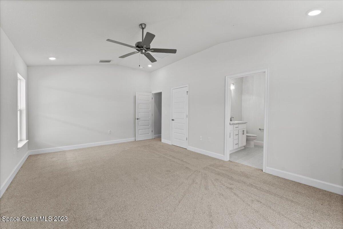 1341 Tupelo Circle Cocoa, FL 32926 - Photo 17 of 27 a view of a livingroom with a ceiling fan and window