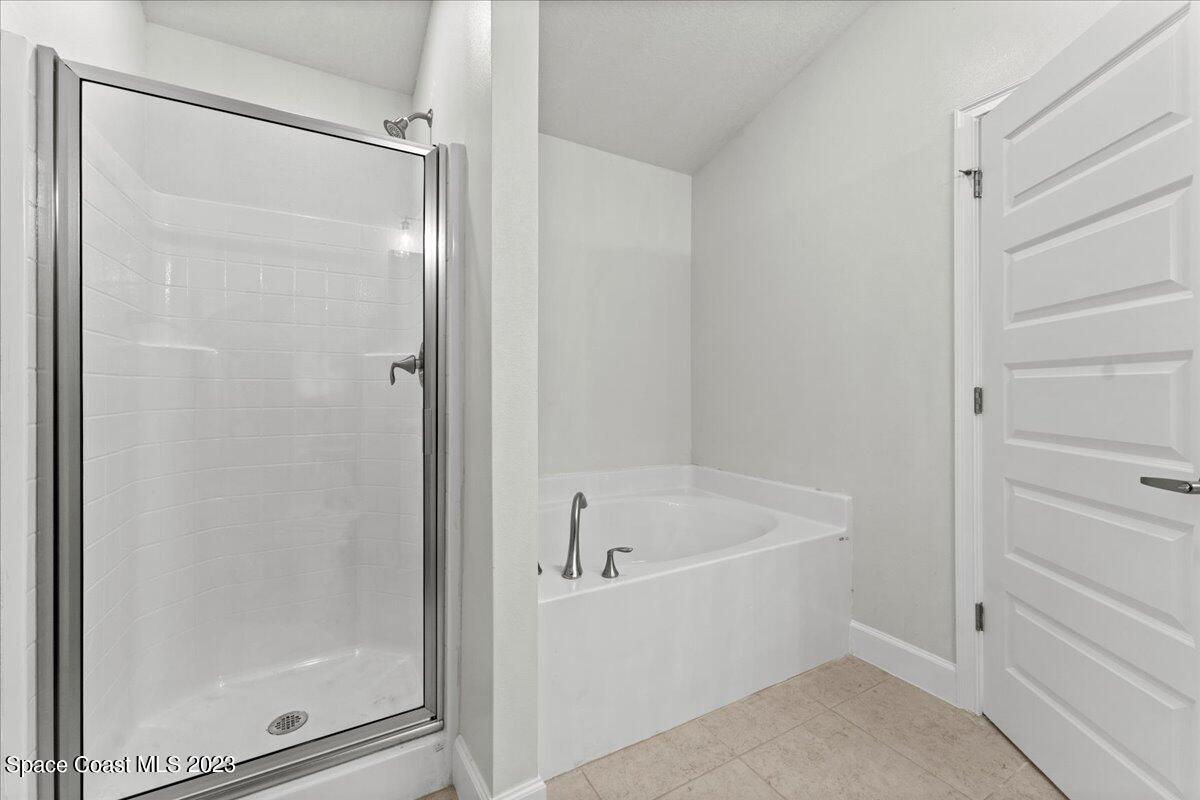 1341 Tupelo Circle Cocoa, FL 32926 - Photo 19 of 27 a white bath tub with a shower